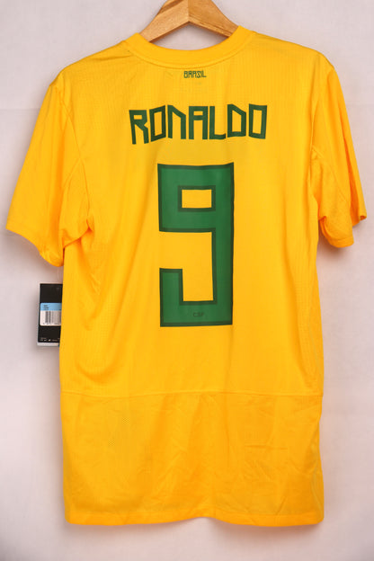 A yellow soccer jersey with the name 'RONALDO' and the number '9' on the back, displayed on a hanger. Brazil 2011 home shirt kit jersey Ronaldo #9 size M Nike football soccer BNWT